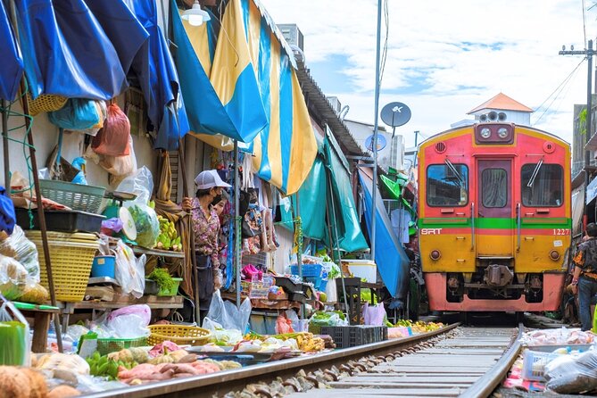Amphawa Floating Market & Maeklong Railway Train Market Tour - Maeklong Railway Market, where the tracks run through the stalls
