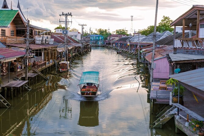 Amphawa Floating Market & Maeklong Railway Train Market Tour - Wat Bang Kung and the temple inside the banyan roots