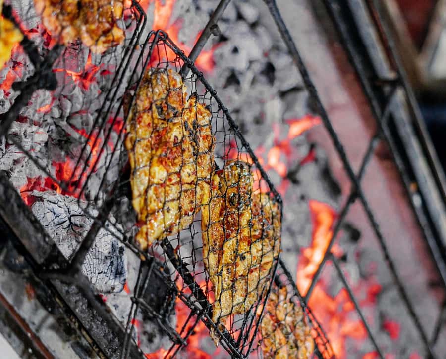 Bali: Jimbaran Seafood Market Tour with Sunset Dinner - Jimbaran Market, where the evening begins