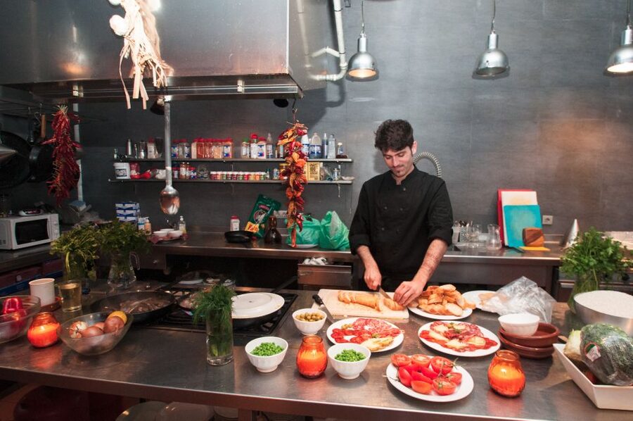 Barcelona: Paella Cooking Experience & Boqueria Market Tour - Making pan con tomate and pintxos