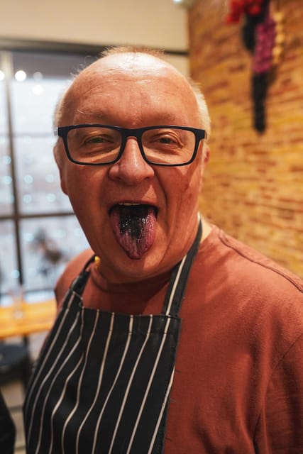 Barcelona: Seafood Paella Cooking Class & Boqueria market - Sitting down to eat your own cooking