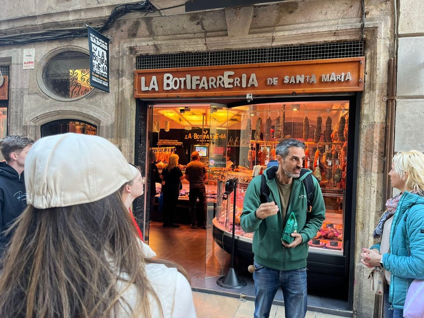 Barcelona: Street Food & Sightseeing Tour with Local Market - Entering La Boqueria, Barcelona’s food theater
