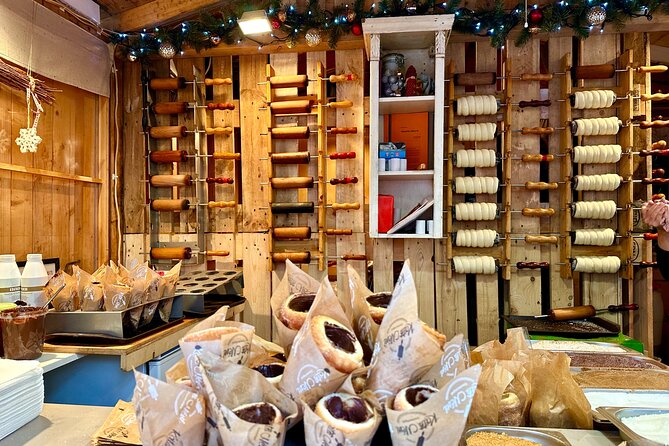 Budapest Wonderland - A Christmas Market Tour with Chimney Cake & Mulled Wine - Learning how chimney cake is made