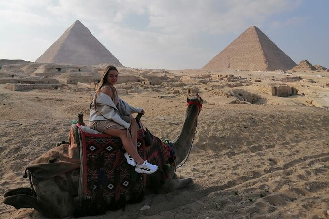 Cairo layover tour Giza pyramids Egyptian museum local bazaars Camel ride Lunch - Facing the pyramids of Giza