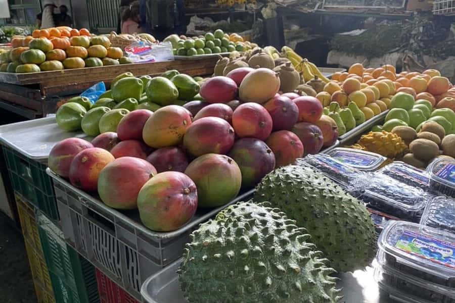 Cali: Fruit Market Walking Tour with Tastings - Walking through Cali’s open markets