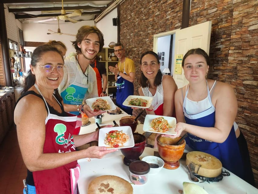 Chiang Mai: Morning Cooking Class with Market Visit - Picking herbs at the organic garden