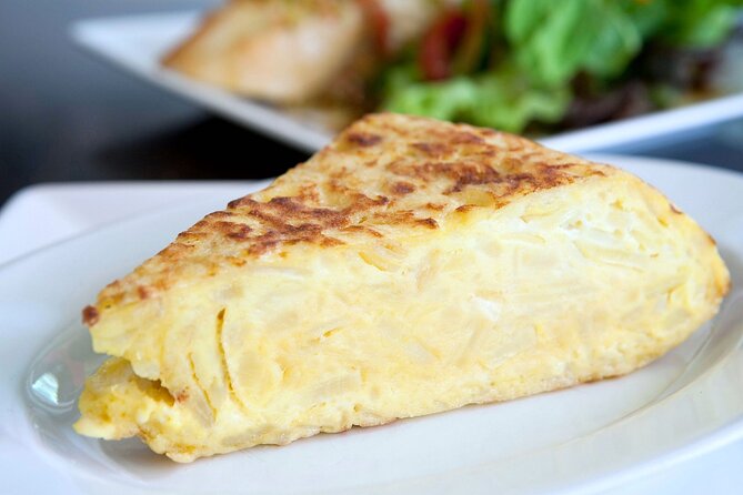Cook Paella & Tapas + Market Tour in Barcelona (4-Course Meal) - Making tortilla with potatoes, onions, and eggs