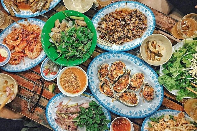 Da Nang By Night: Seafood dinner, night market and cruise trip - Riding through Da Nang after sunset