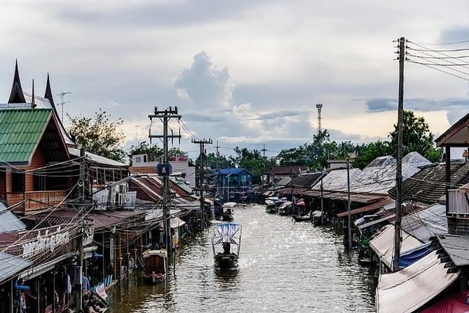 Damnoen Floating Market & Optional Erawan Water Waterfall Tour - Maeklong Railway Market and the train-track spectacle