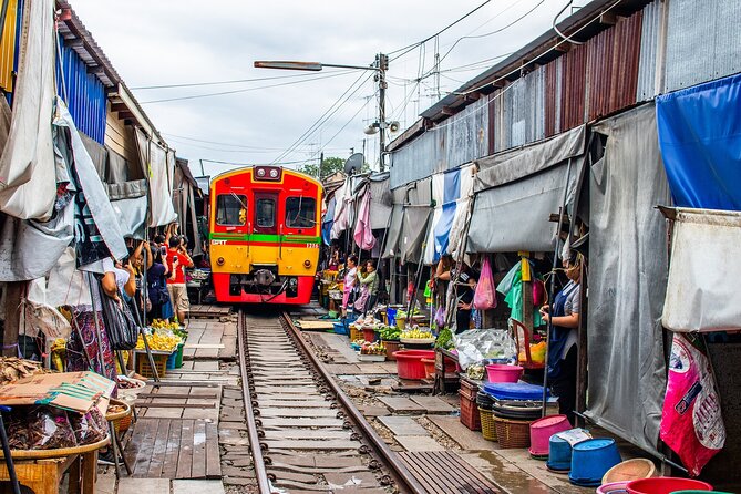Damnoen Saduak Floating Market and Maeklong Railway Market Tour - Transport, guide quality, and what is included
