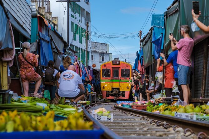 Damnoen Saduak Floating Market & Ayutthaya Tour from Bangkok - Mae Klong Railway Market and the train that cuts through it