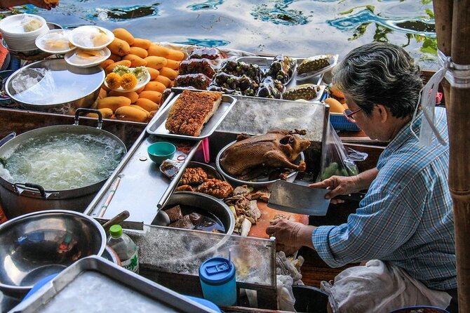 Damnoen Saduak Floating Market & Maeklong Railway Market Tour From Bangkok - Maeklong Railway Market and the slow-moving train