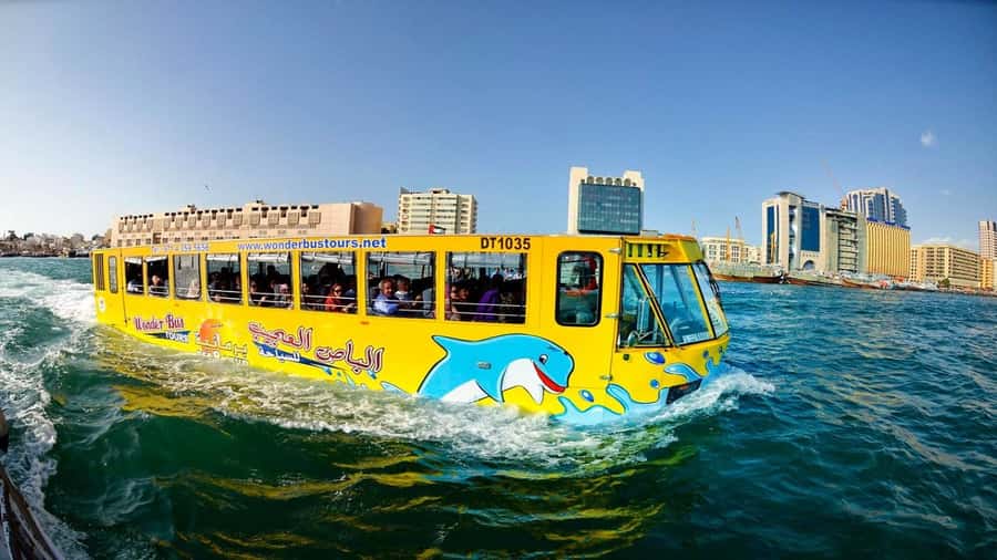 Dubai: Old town tour with Wonder Bus, souks, Creek and Guide - A quick look at souks, boats, and local life