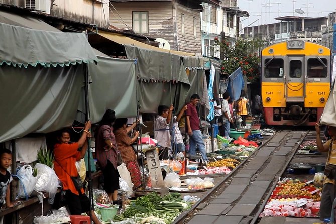 Famous Markets Tour: Maeklong Railway & Damnoen Saduak Floating - Maeklong Railway Market and the train that cuts through it