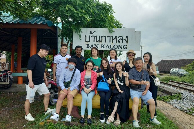 Floating & Railway Markets and Erawan Waterfall [Optional Luxury] - Riding the train into Mae Klong Railway Market