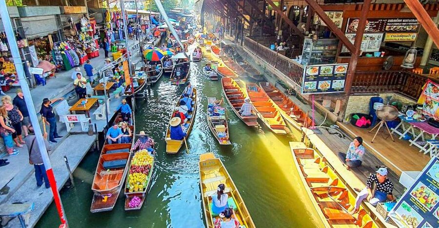 From Bangkok: Damnoen Saduak & Train Market Tour in Spanish - Key points at a glance
