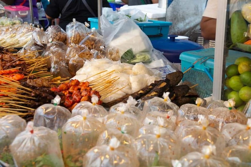 From Bangkok: Don Wai Market, Wat Samphran & Lotus Café Tour - Transport, timing, and the return to Bangkok