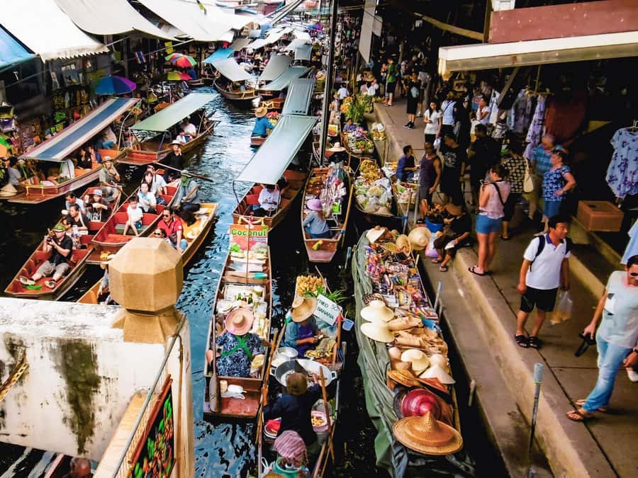 From Bangkok: Maeklong Railway and Floating Market Day Tour - A longtail boat ride into Damnoen Saduak