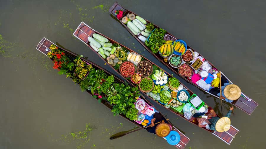 From Bangkok: Maeklong Railway and Floating Market Food Tour - The train that cuts through Mae Klong Market