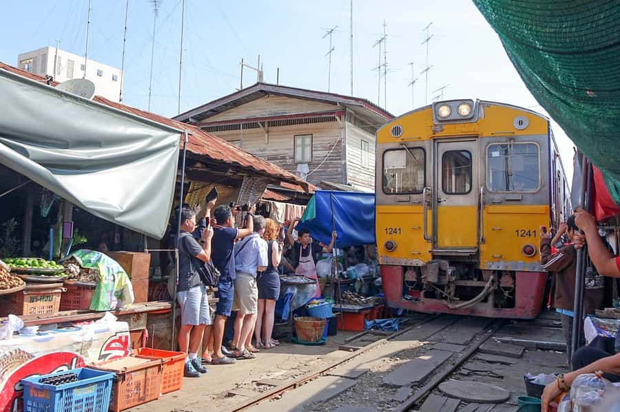 From Bangkok: Maeklong Railway and Floating Market Food Tour - Reaching the floating market by longtail boat