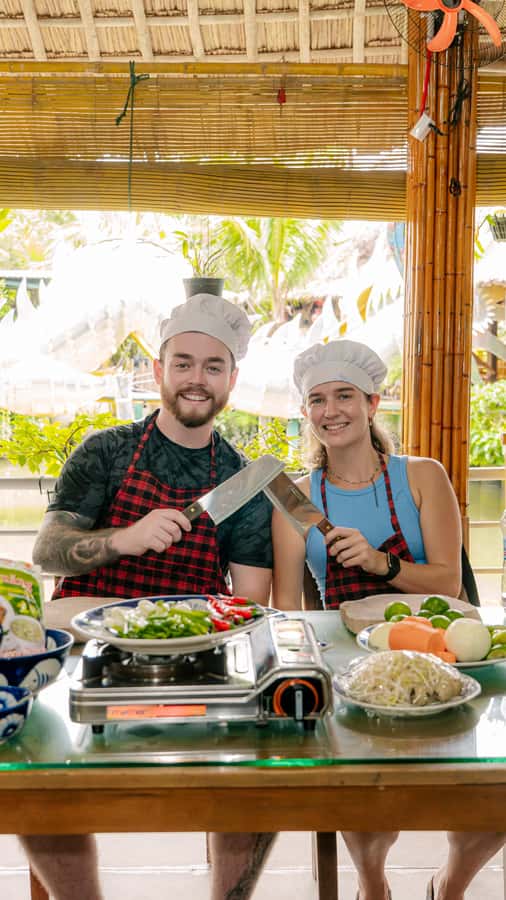 From Hoi An: Market Tour, Basket Boat Ride and Cooking Class - Riding a round basket boat through coconut palms