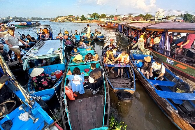 HCM: 2-Day Mekong Delta Floating Market with Cooking & Bike Ride - A rowing boat through the narrow canal