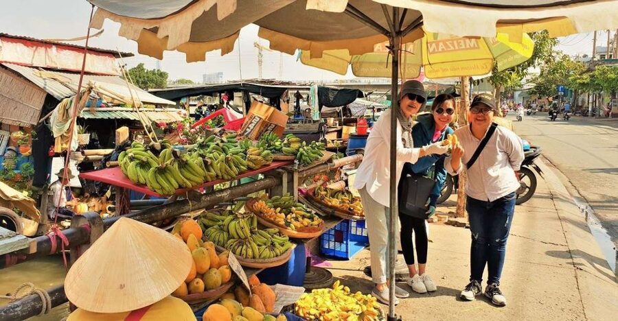 Ho Chi Minh City: Saigon Morning Markets Tour by Motorbike - Riding through Saigon behind a local guide
