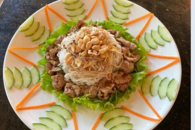 Hoi An: Bay Mau Eco Cooking Tour - Working with rice tools before the cooking begins