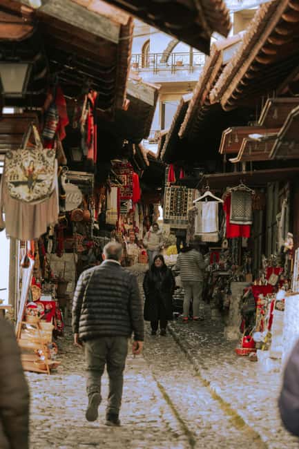 Kruja by Night: Castle & Bazaar Tour from Tirana - Walking through Kruja Castle