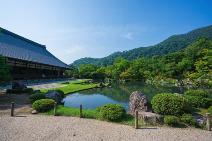 Kyoto: Arashiyama Unveiled Bamboo, Temple, Matcha, & Monkeys - Togetsu-kyo Bridge frames the river and hills