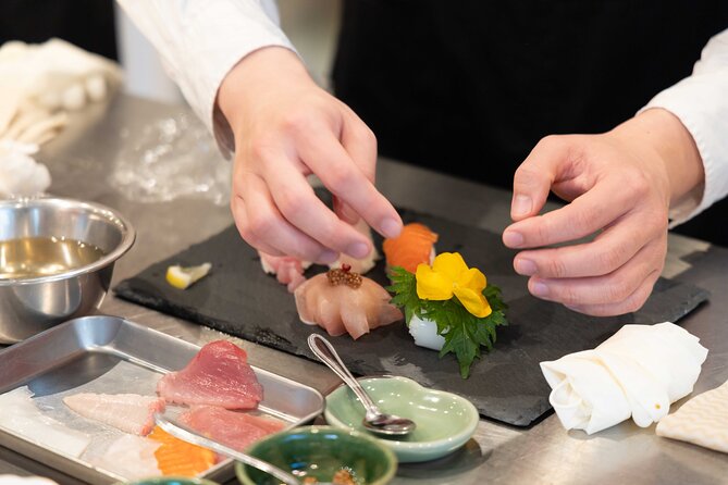 Kyoto: Enjoy Sushi & Market Tour! Best for Family & Couple! - Watching fish preparation at Nishiki Market