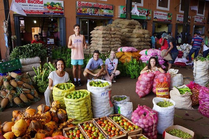 Local Market Tour & Cooking Demo with Lunch from Colombo Harbor - Choosing vegetables and fruit at a local market