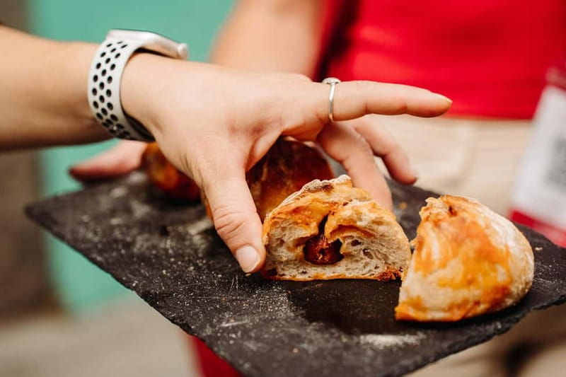Madrid: Ultimate Food Tour of Local Markets & Tapas - Stuffed bread at MOEGA Empanadas y Pan Gallego