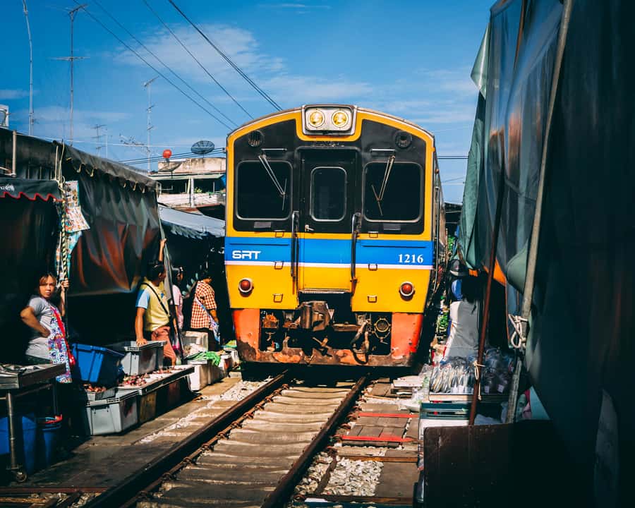 Mahachai & Maeklong Railway Market Day Tour From Bangkok - Leaving Bangkok by wooden-seat train