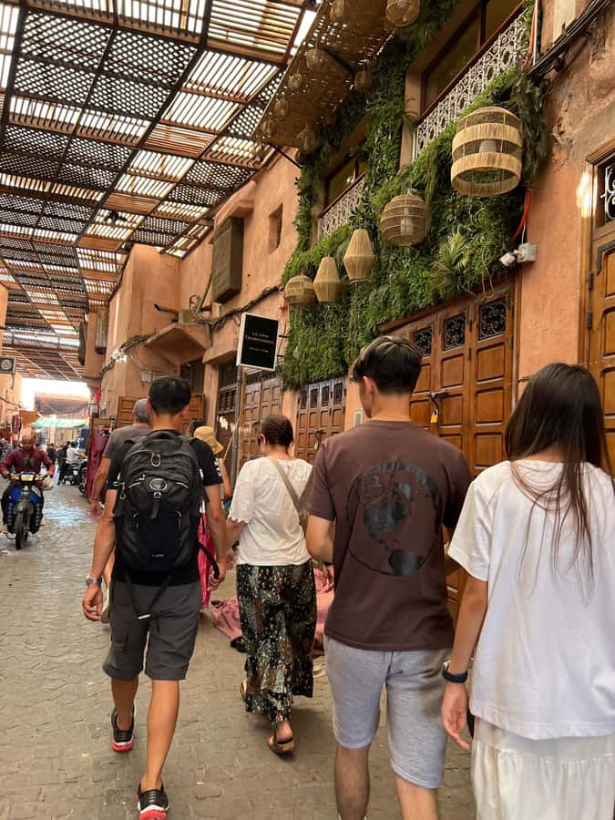 Marrakech: Traditional Moroccan Cooking Class & Market Visit - Entering Khmisa’s intimate Medina workshop