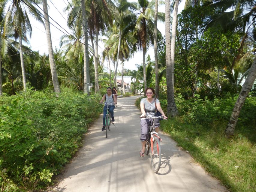 Mekong Day Tour by Car:Cai Be market, Local Island & Cycling - The hand-rowed sampan through narrow canals