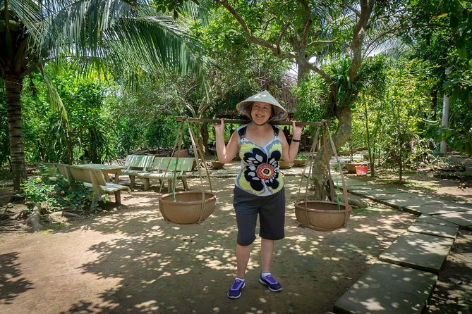 Mekong Delta 2-Day Tour: Floating Markets & Cultural Exploration - Coconut candy, fruit, and a narrow canal ride