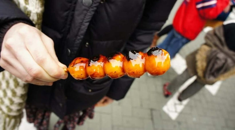 Osaka: Food Tour Kuromon Market & Dotonbori with Guide - Dotonbori’s neon streets and Ebisu Bridge
