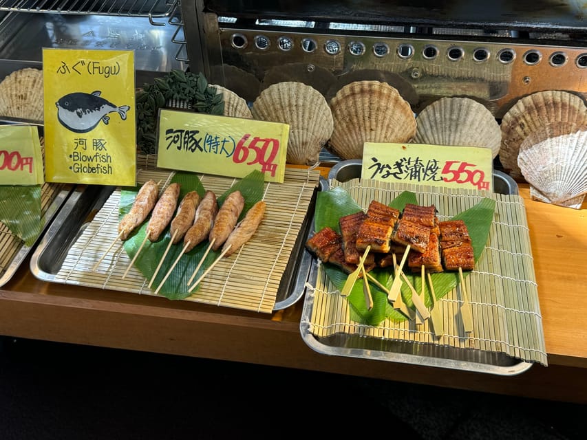 Osaka: Kuromon Market 1.5-Hour Seafood & Street Food Tour - Seafood, sushi, and grilled specialties