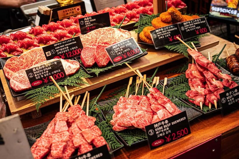 Osaka: Kuromon Market Street Food Tour with Pro Local Guide - Grilled scallops, yakitori, and takoyaki