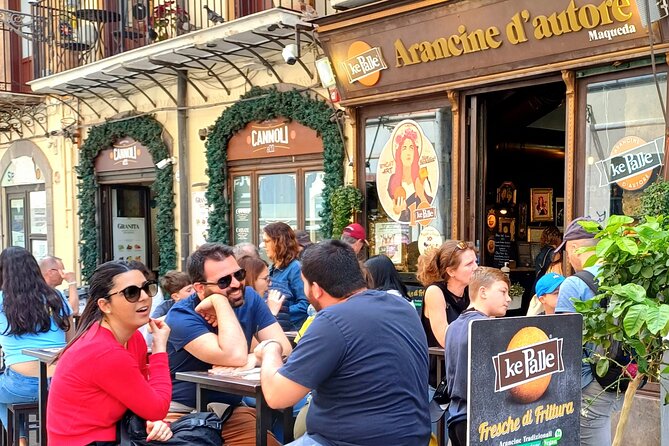 Palermo, a tour of unique monuments and colorful markets - Ancient walls and the gate into Capo Market