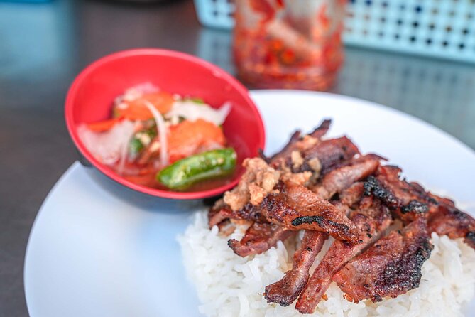 Phnom Penh Morning Market & Food Tour by Tuktuk - Includes All Food & Drinks! - Walking through a Phnom Penh wet market