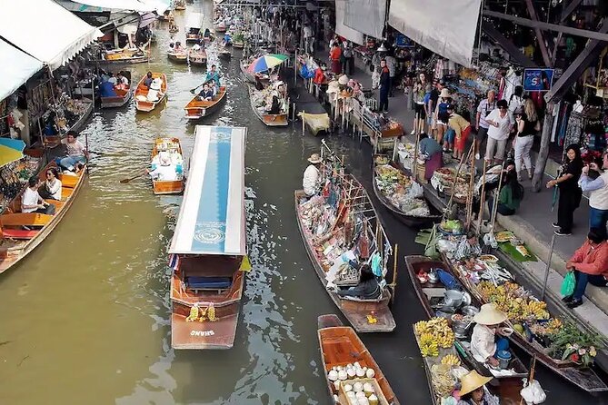 Private Damnoen Saduak and Maeklong Railway Market Tour(min 2pax) - Maeklong Railway Market and the umbrella pull-down moment
