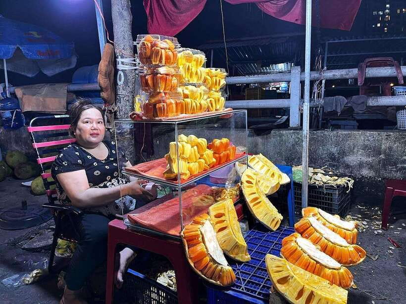 Saigon: Floating Market and Food Tasting Tour by Scooter - Bánh xèo in District 1 with a skyline view