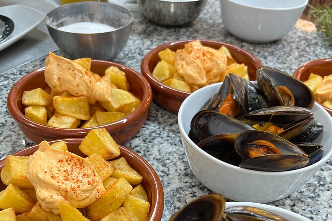 Seafood paella cooking class, tapas and visit to Ruzafa market. - Starting at San Valero Parish at 11 a.m.