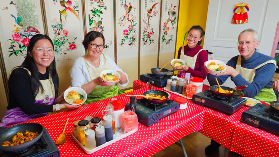 Seoul: Korean Cooking Class at a Local Home and Market Tour - Sampling street food before the cooking begins