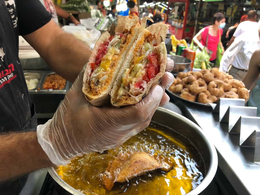 Tel Aviv: 2-Hour Carmel Market Tour in English with Lunch - Carmel Market through food stalls and spice displays