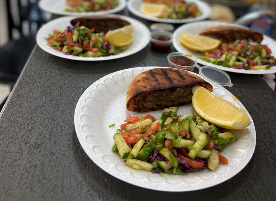 Tel Aviv: 2-Hour Jaffa Flea Market Tour with Tastings - Walking through a market with two lives