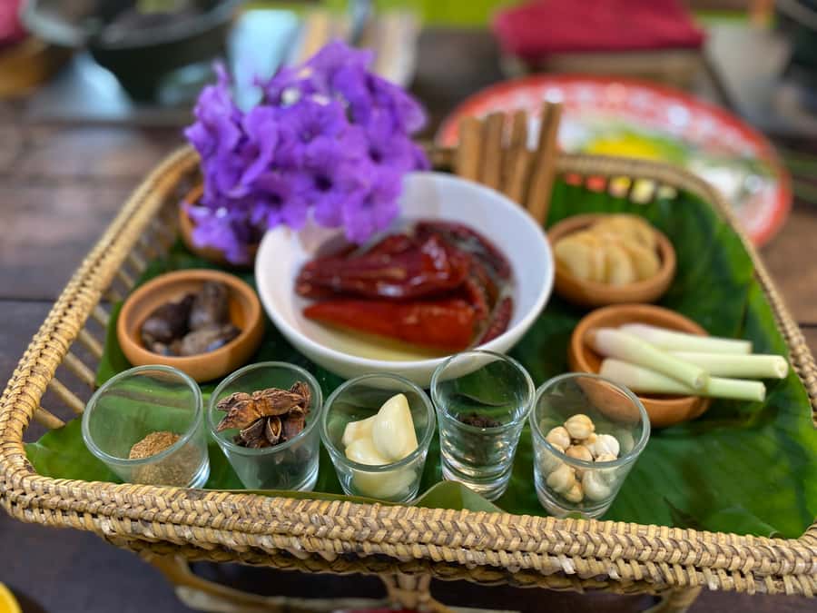 Thai cooking class &Market tour by Amazon Prime Series Chef. - Eating together in an open-air kitchen