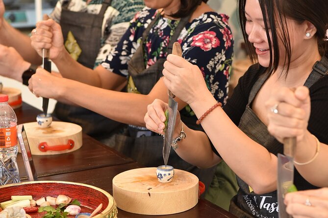 Thai Cooking Class with Market Tour in Sathon Bangkok - Grinding curry paste from scratch